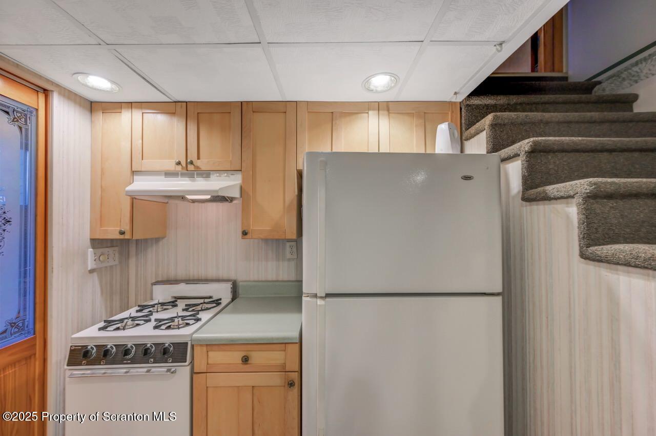 216 Prospect Street Dunmore, PA 18512 - Photo 26 of 81 a kitchen with a stove top oven and refrigerator