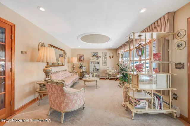 a dining room with furniture and window