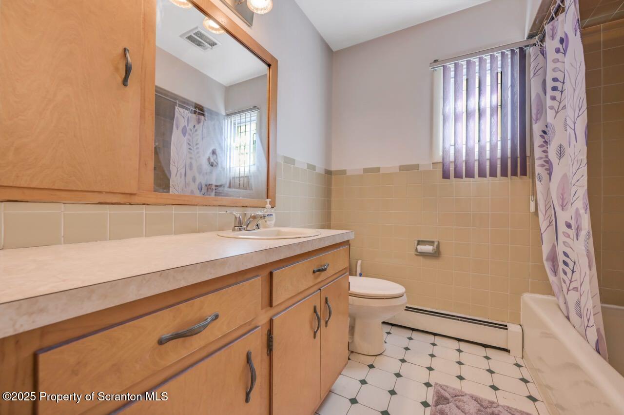 216 Prospect Street Dunmore, PA 18512 - Photo 46 of 81 a bathroom with a sink a toilet a shower and a mirror
