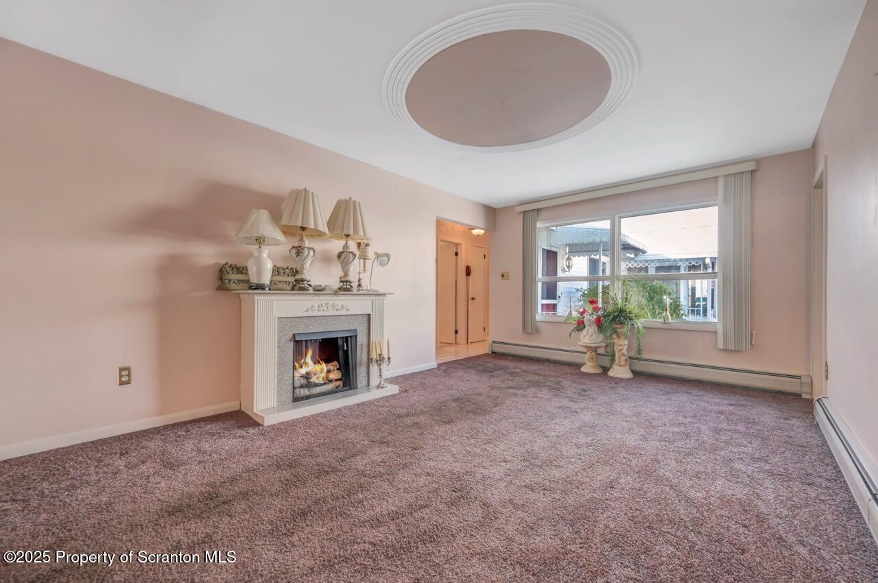 216 Prospect Street Dunmore, PA 18512 - Photo 49 of 81 a view of an empty room with a fireplace and a window