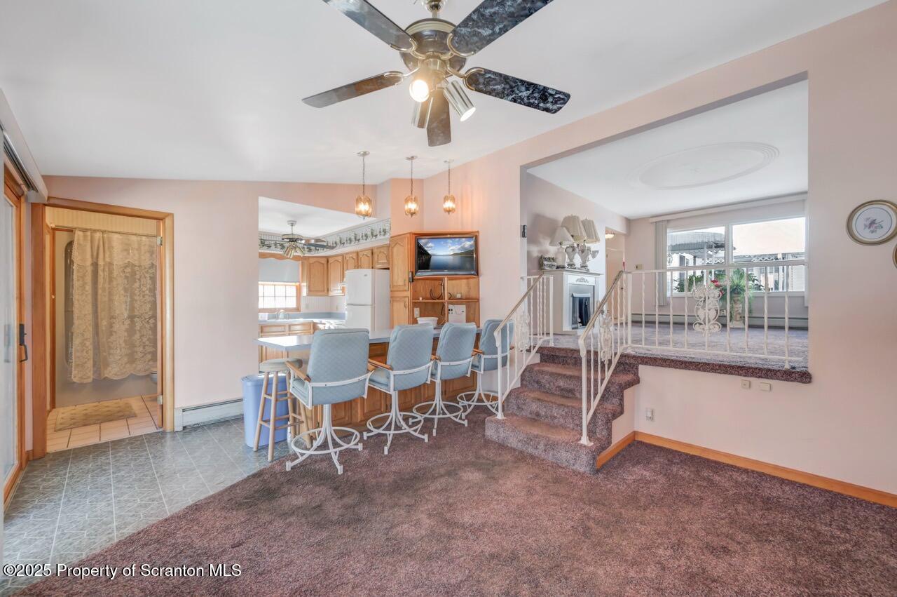 216 Prospect Street Dunmore, PA 18512 - Photo 52 of 81 a view of a livingroom with furniture and a ceiling fan