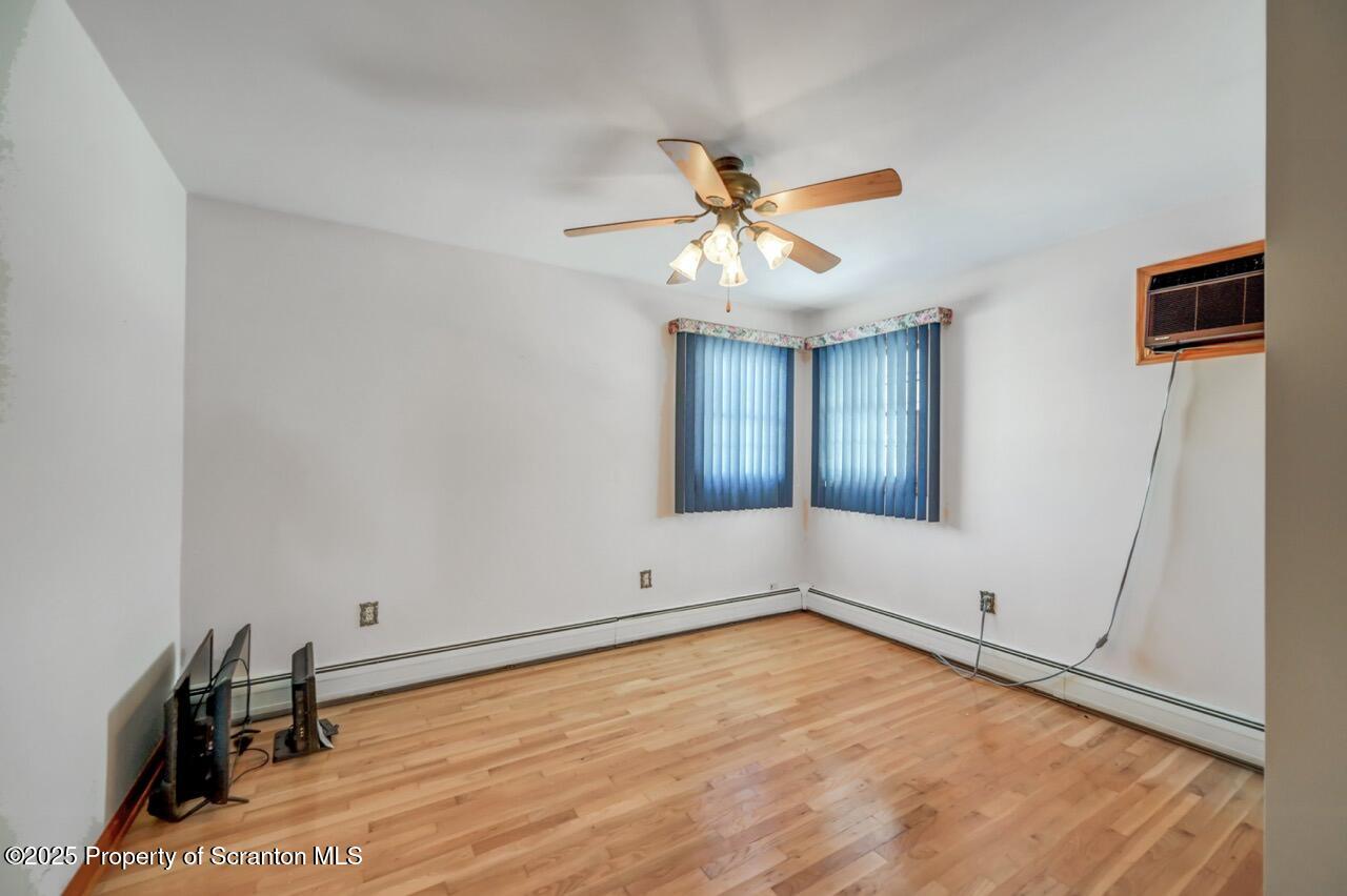 216 Prospect Street Dunmore, PA 18512 - Photo 56 of 81 a view of empty room with window and ceiling fan