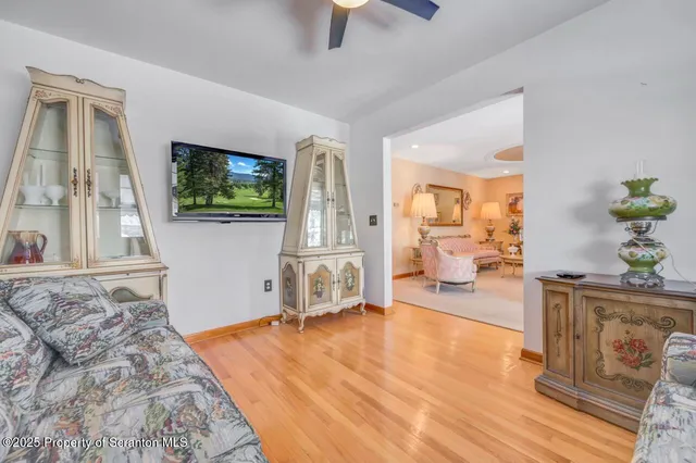 a bed room with a bed and a ceiling fan