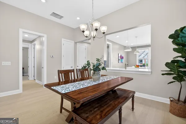 a dining room with furniture and window