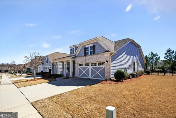 a front view of a house with a yard