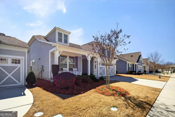 a front view of a house with a yard