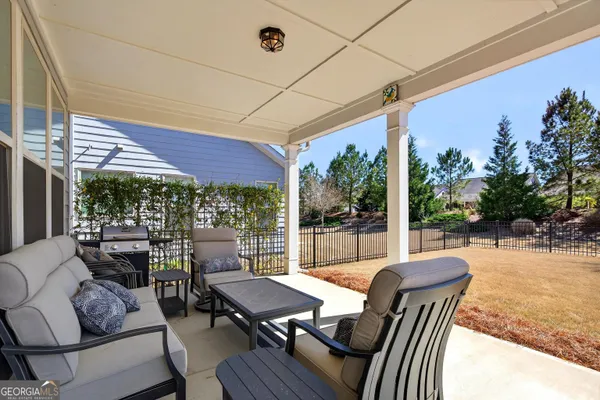 a view of a house with roof deck and seating space
