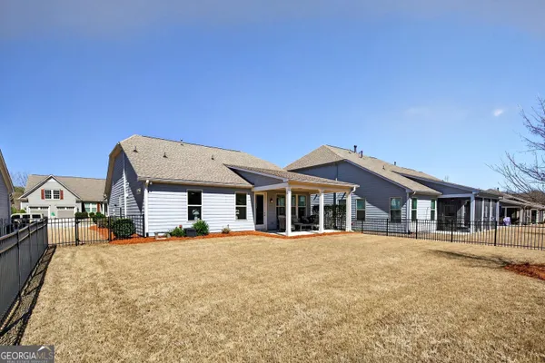 an aerial view of a house with roof deck