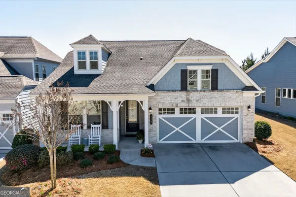 an aerial view of a house with a yard