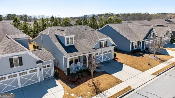 an aerial view of multiple houses with outdoor space