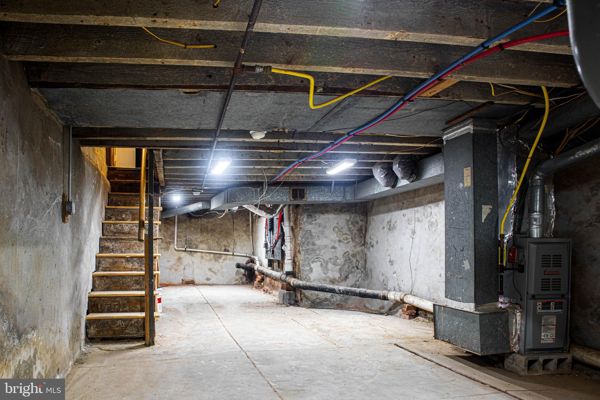 2348 Moore Street Philadelphia, PA 19145 - Photo 23 of 27 a view of water heater room with stairs