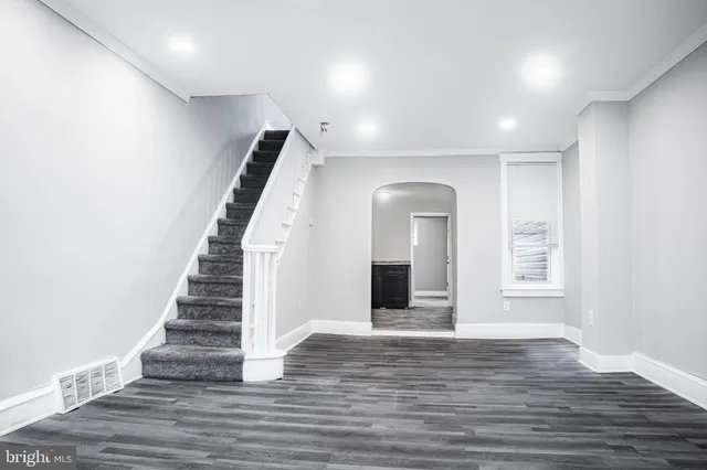 a view of an entryway with wooden floor