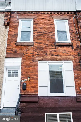 a front view of a house with glass windows