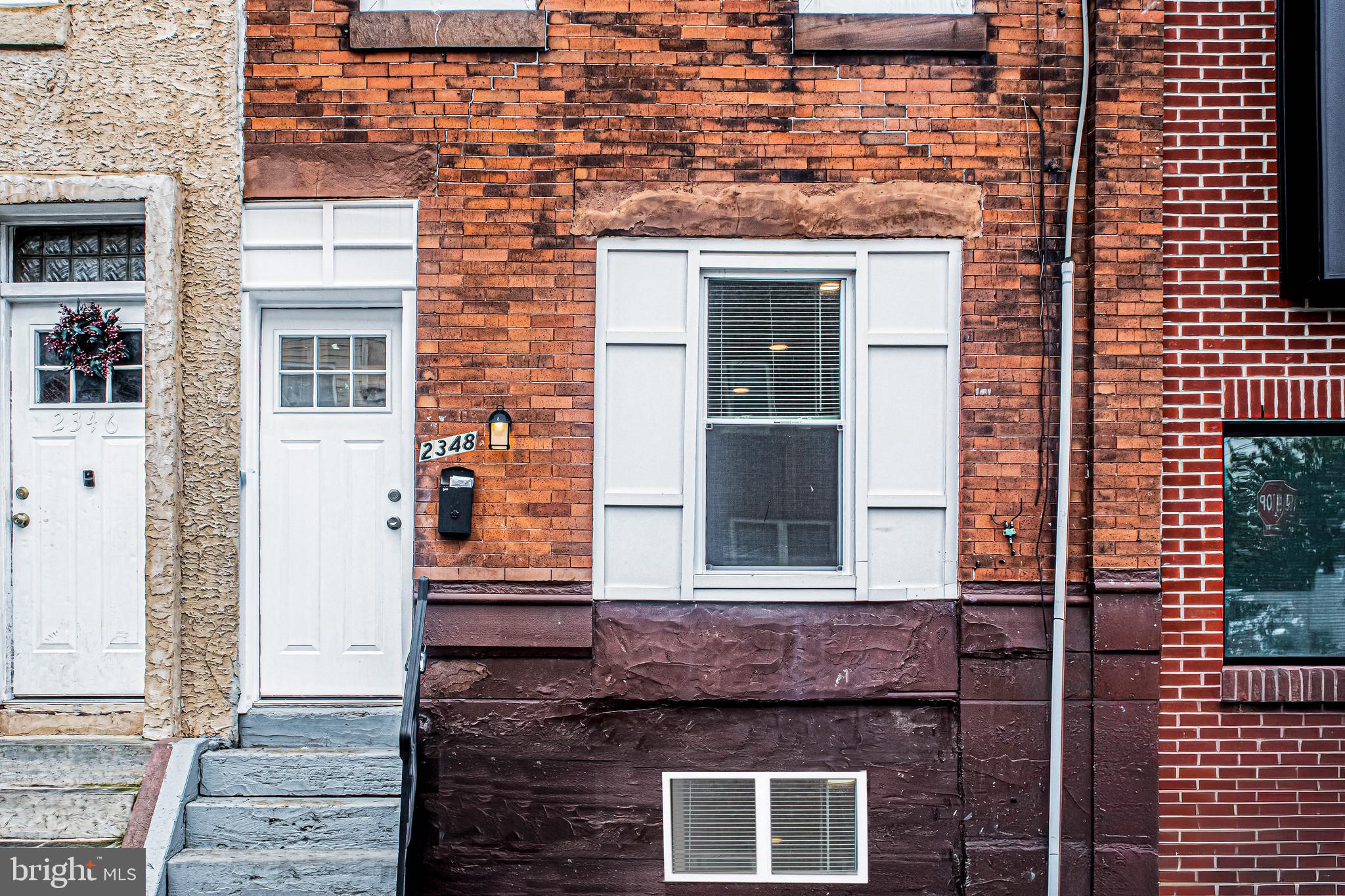 2348 Moore Street Philadelphia, PA 19145 - Photo 9 of 27 a front view of a house with glass windows