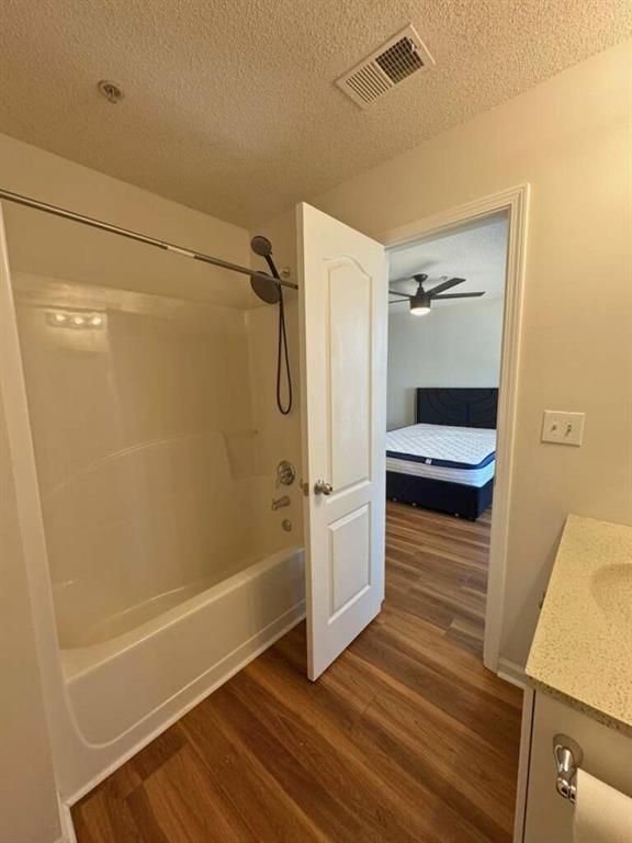 1748 Broad River Road Atlanta, GA 30349 - Photo 18 of 20 a bathroom with a tub and shower