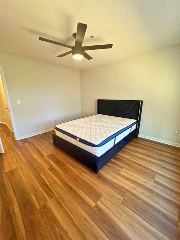 1748 Broad River Road Atlanta, GA 30349 - Photo 19 of 20 a bedroom with a bed and a ceiling fan