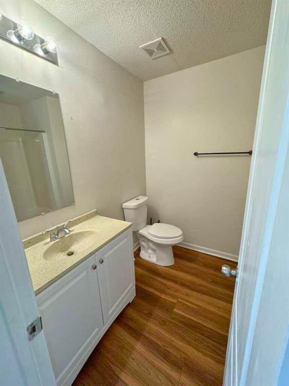1748 Broad River Road Atlanta, GA 30349 - Photo 20 of 20 a bathroom with a granite countertop sink toilet and a mirror