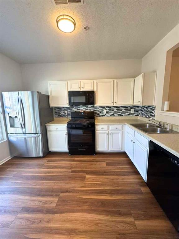 1748 Broad River Road Atlanta, GA 30349 - Photo 3 of 20 a large kitchen with stainless steel appliances granite countertop a stove a sink dishwasher and a refrigerator