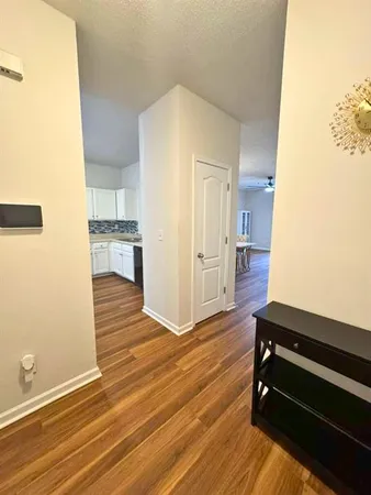 a room with wooden floor and furniture