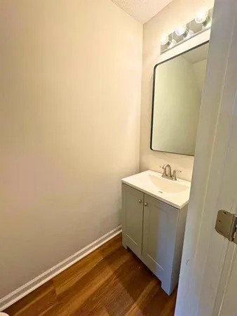 a bathroom with a sink and mirror