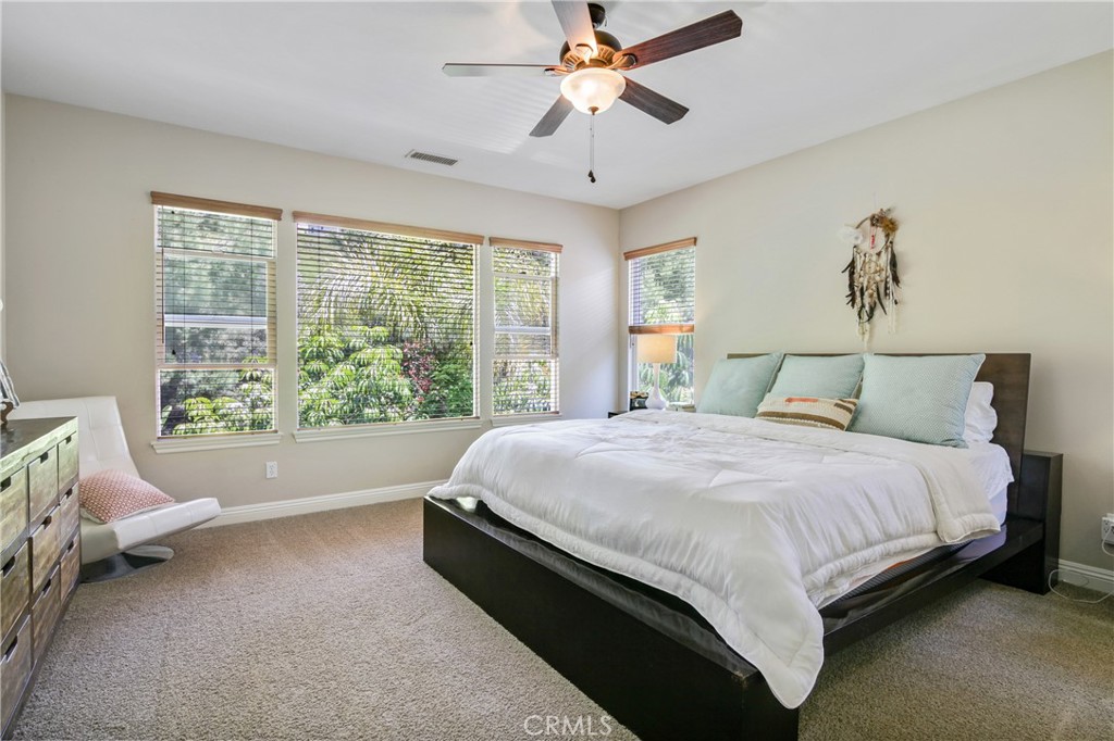 1609 Vista Luna San Clemente, CA 92673 - Photo 11 of 33 a bedroom with a bed chair and window