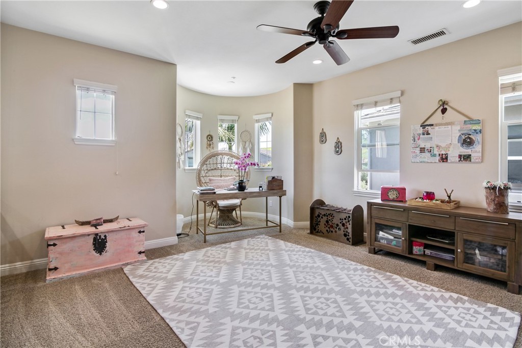 1609 Vista Luna San Clemente, CA 92673 - Photo 15 of 33 a bed room with a bed and a chair