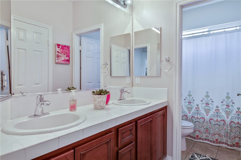 1609 Vista Luna San Clemente, CA 92673 - Photo 17 of 33 a bathroom with a sink and a mirror