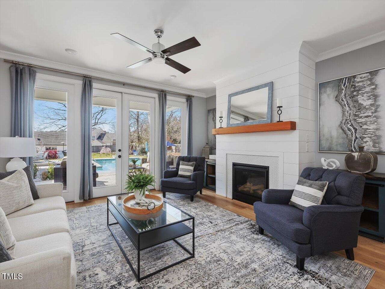 9117 Penny Road Raleigh, NC 27606 - Photo 14 of 72 a living room with furniture fireplace and a large window
