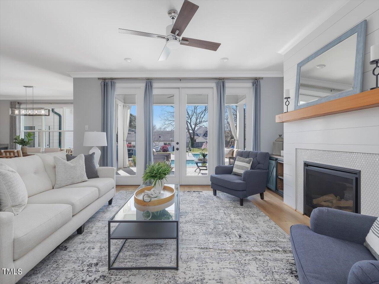 9117 Penny Road Raleigh, NC 27606 - Photo 15 of 72 a living room with furniture and a fireplace