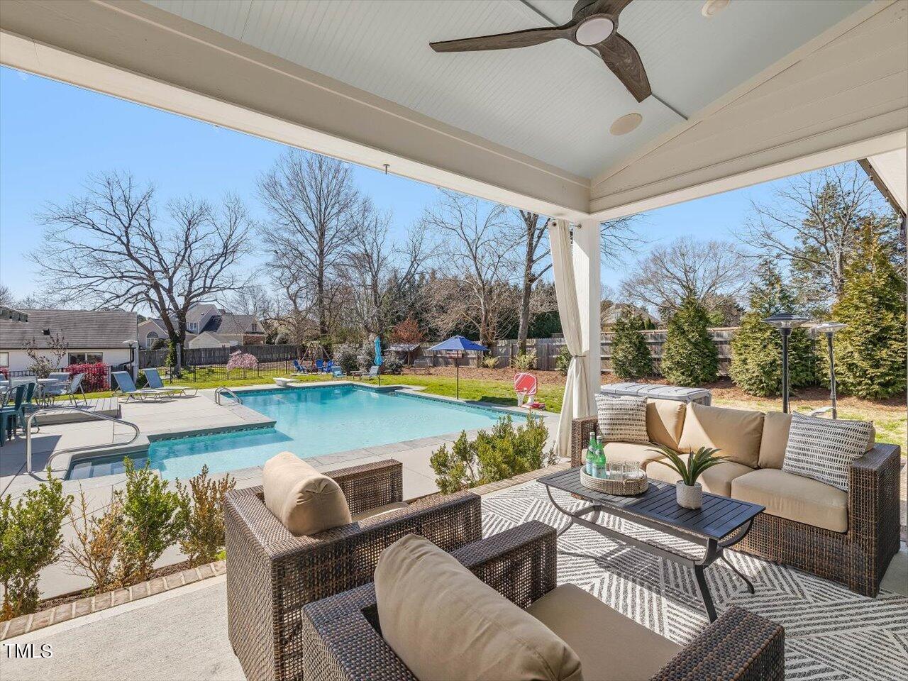 9117 Penny Road Raleigh, NC 27606 - Photo 17 of 72 a view of swimming pool with outdoor seating and a yard