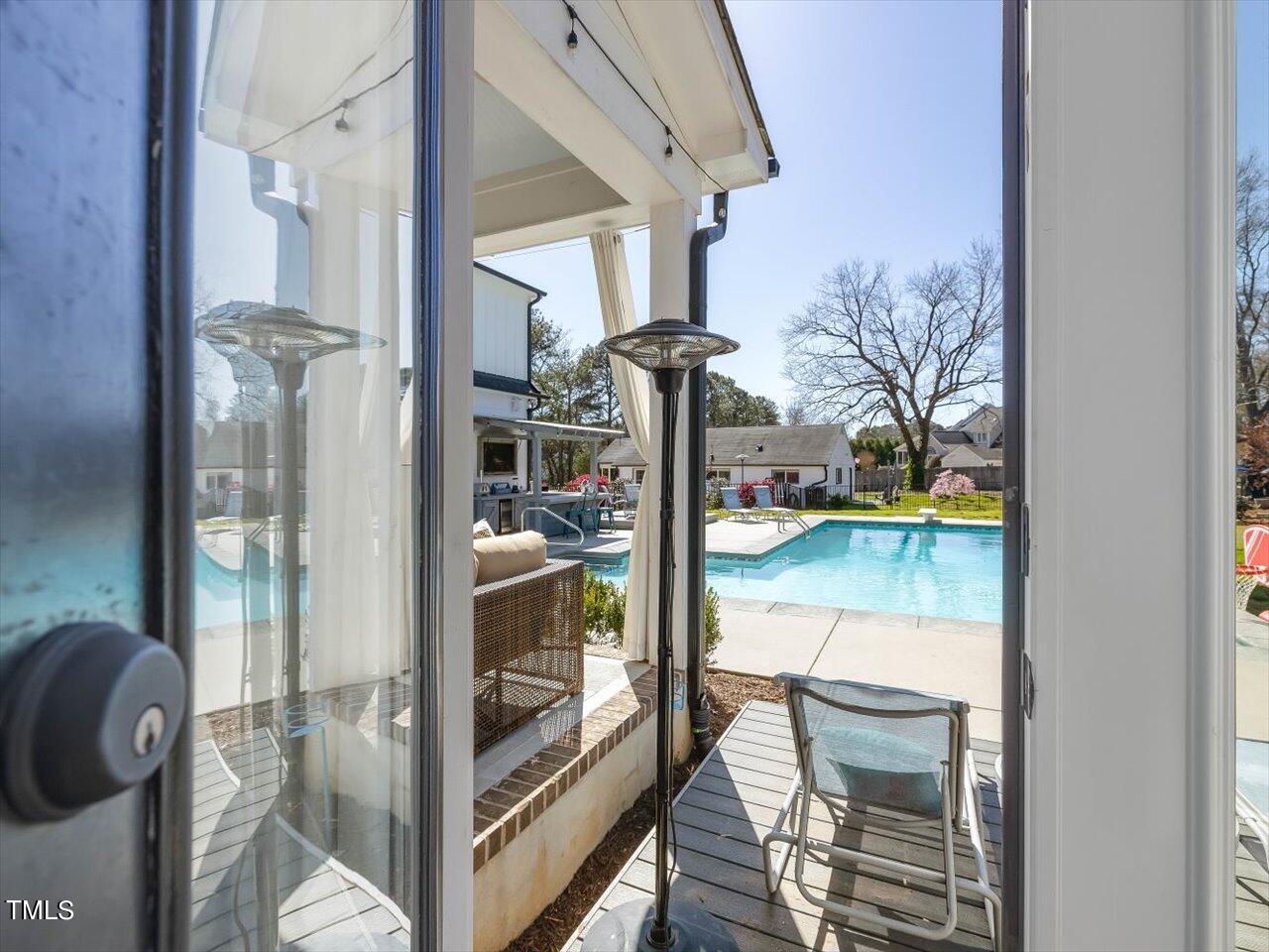 9117 Penny Road Raleigh, NC 27606 - Photo 25 of 72 a view of entryway and hall with wooden floor