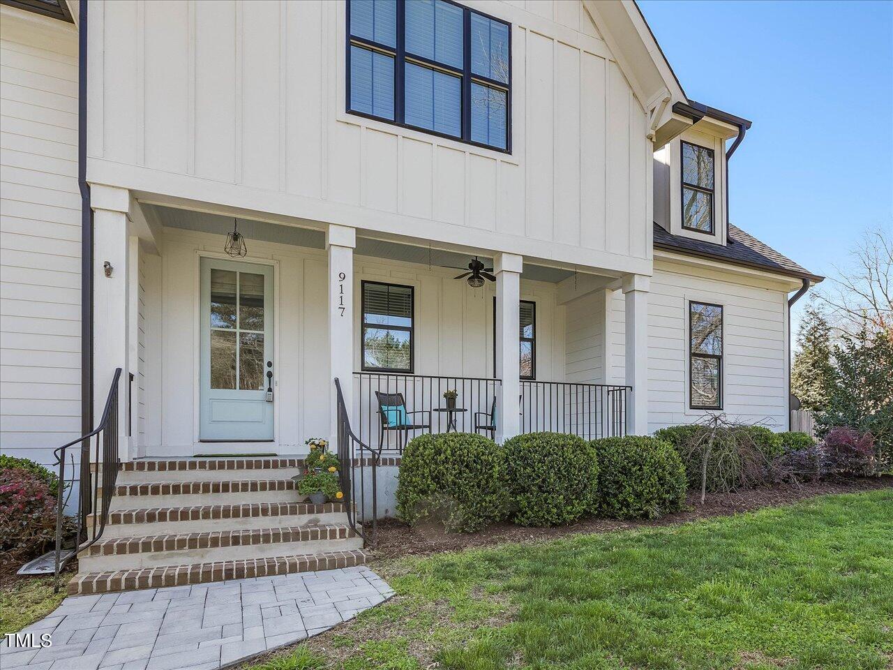 9117 Penny Road Raleigh, NC 27606 - Photo 3 of 72 a front view of a house with a garden