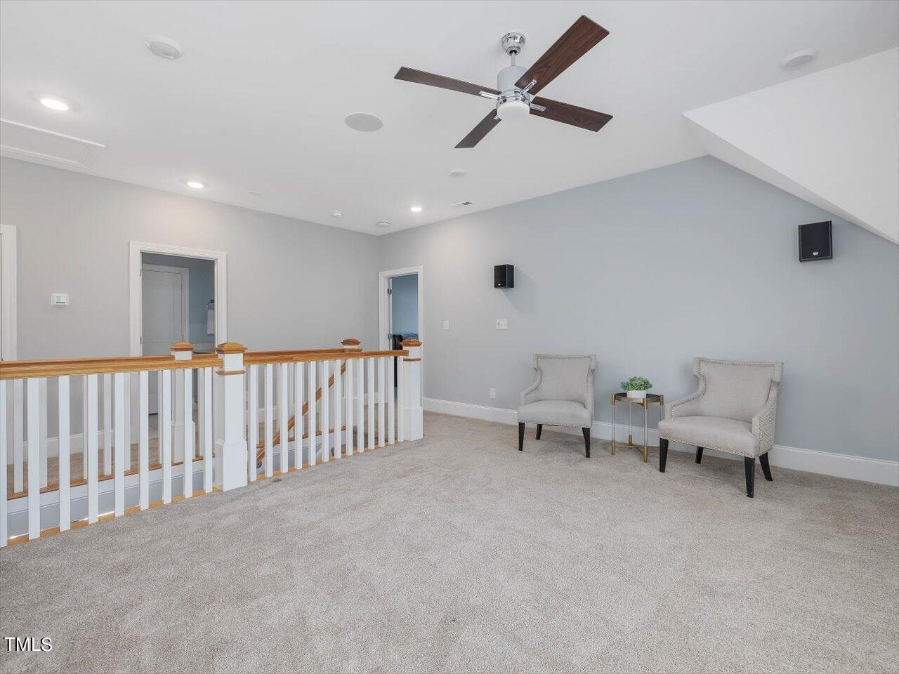 9117 Penny Road Raleigh, NC 27606 - Photo 31 of 72 a living room with furniture and a ceiling fan