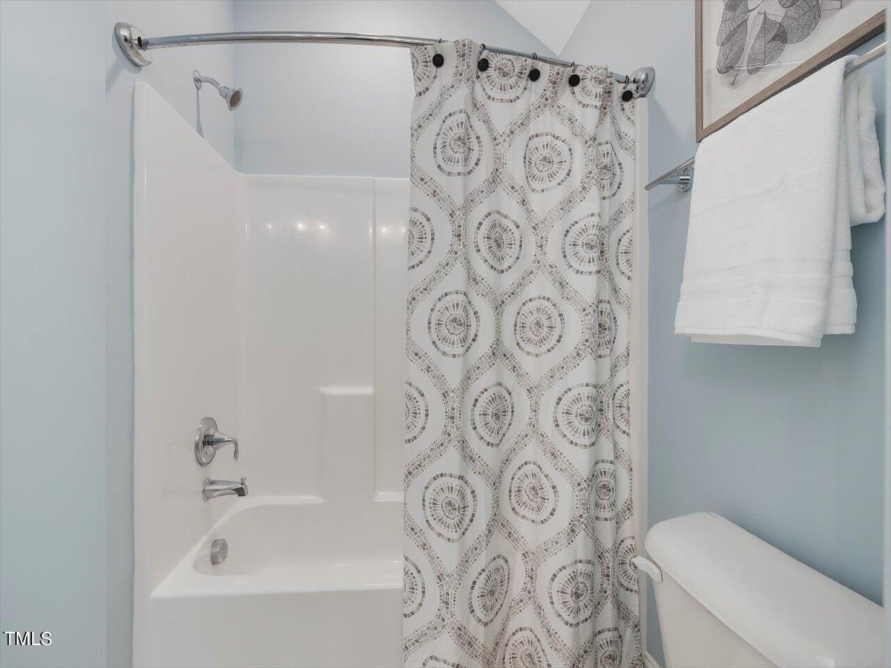 9117 Penny Road Raleigh, NC 27606 - Photo 36 of 72 a bathroom with a bathtub and shower