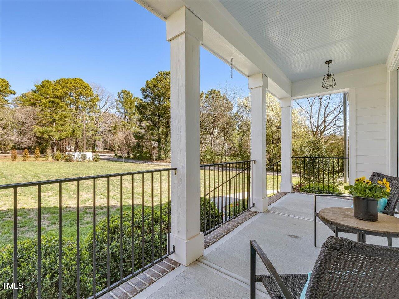 9117 Penny Road Raleigh, NC 27606 - Photo 4 of 72 a view of a balcony with chairs