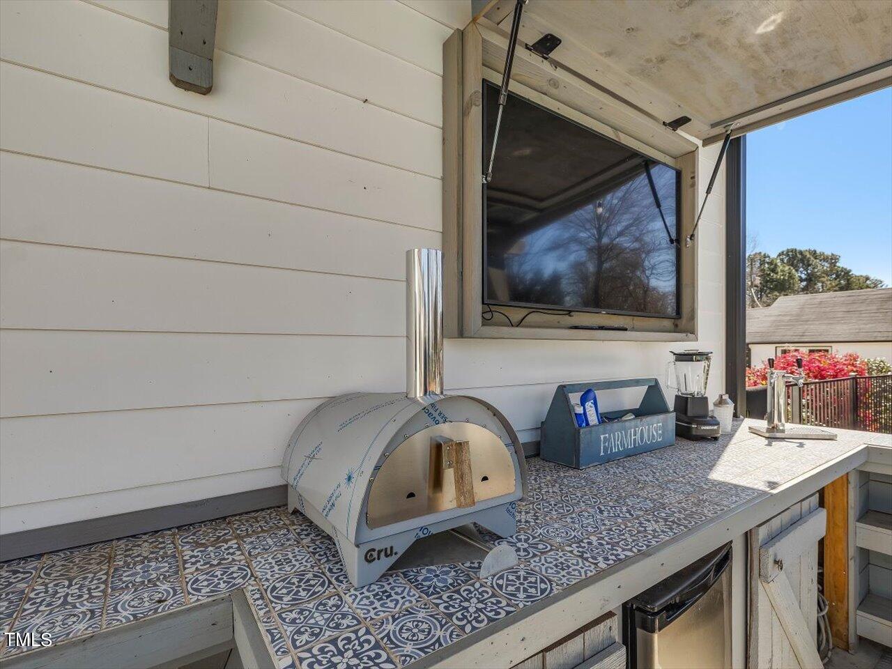 9117 Penny Road Raleigh, NC 27606 - Photo 41 of 72 a bathroom with a granite countertop sink and a mirror