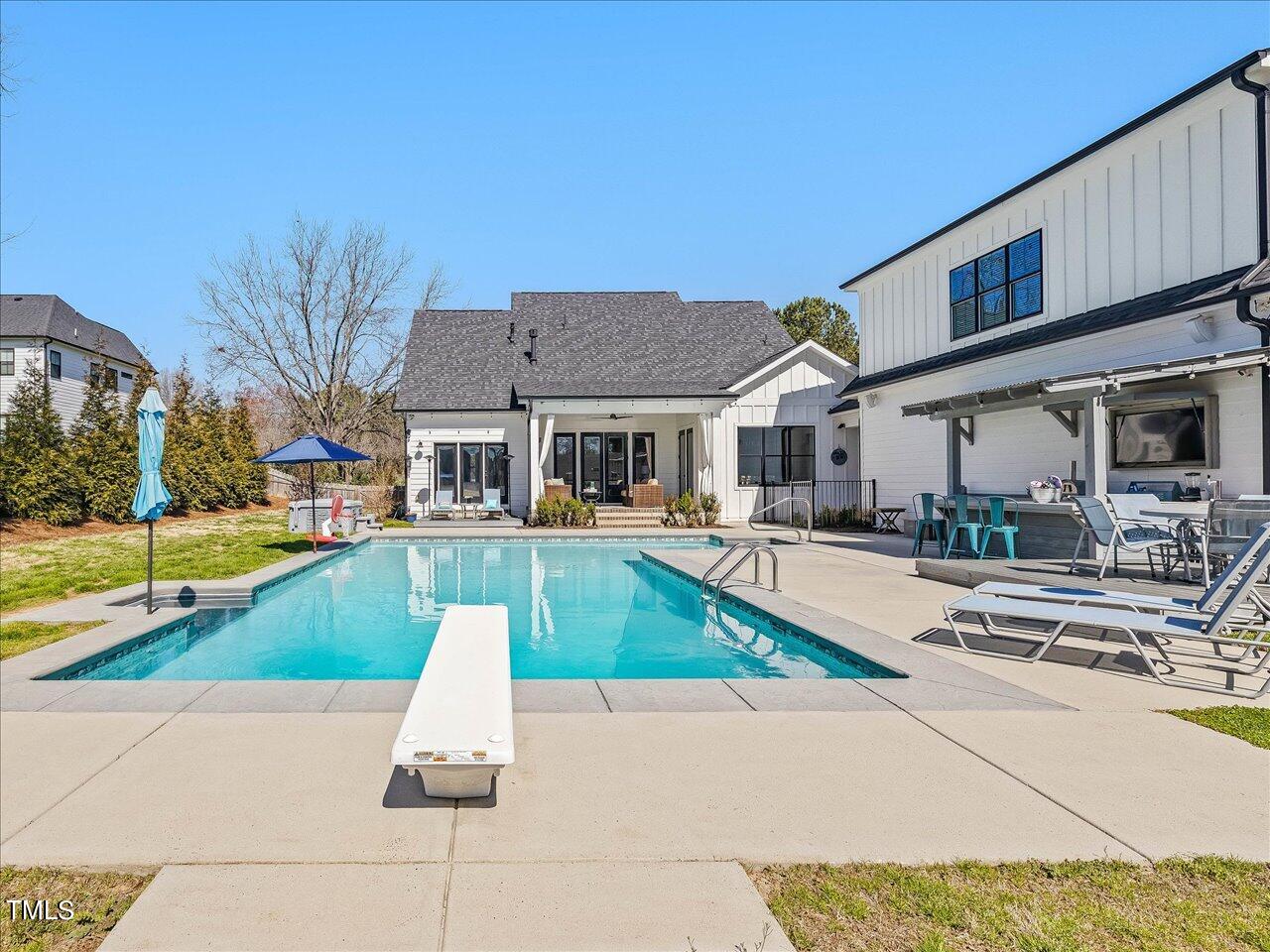 9117 Penny Road Raleigh, NC 27606 - Photo 43 of 72 a view of house with swimming pool and small yard