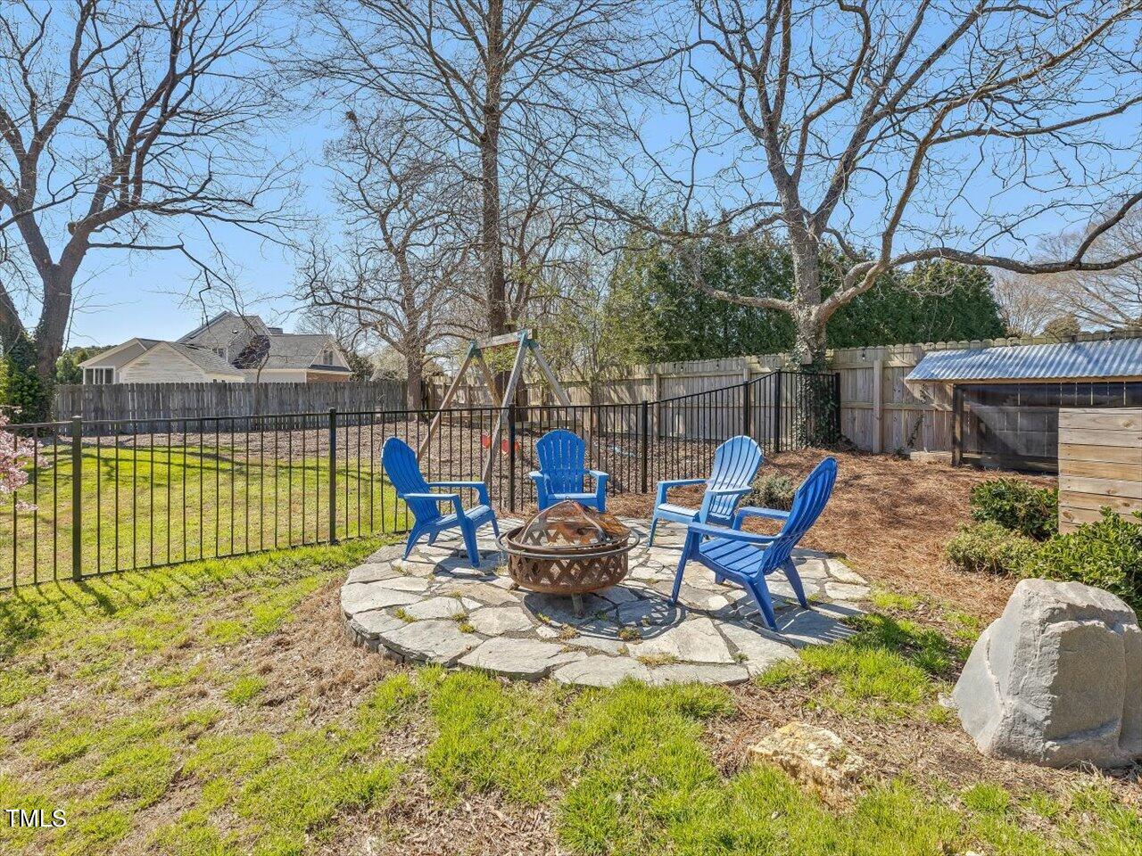 9117 Penny Road Raleigh, NC 27606 - Photo 46 of 72 a view of a lake with a patio