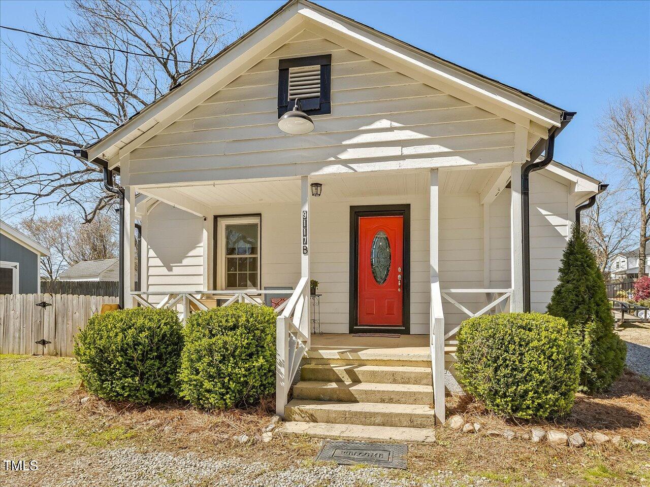 9117 Penny Road Raleigh, NC 27606 - Photo 53 of 72 a front view of a house with garden