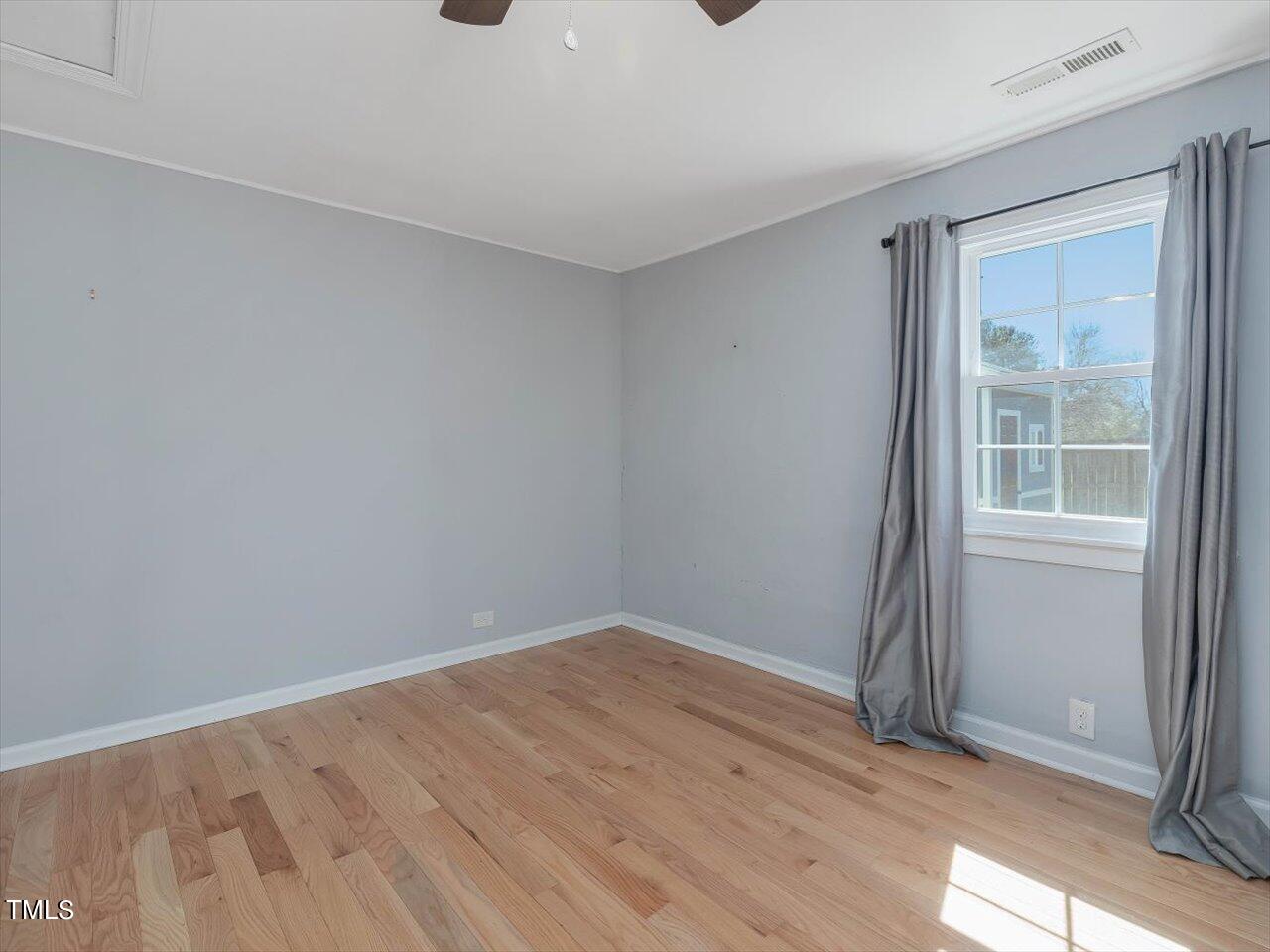 9117 Penny Road Raleigh, NC 27606 - Photo 60 of 72 wooden floor in an empty room