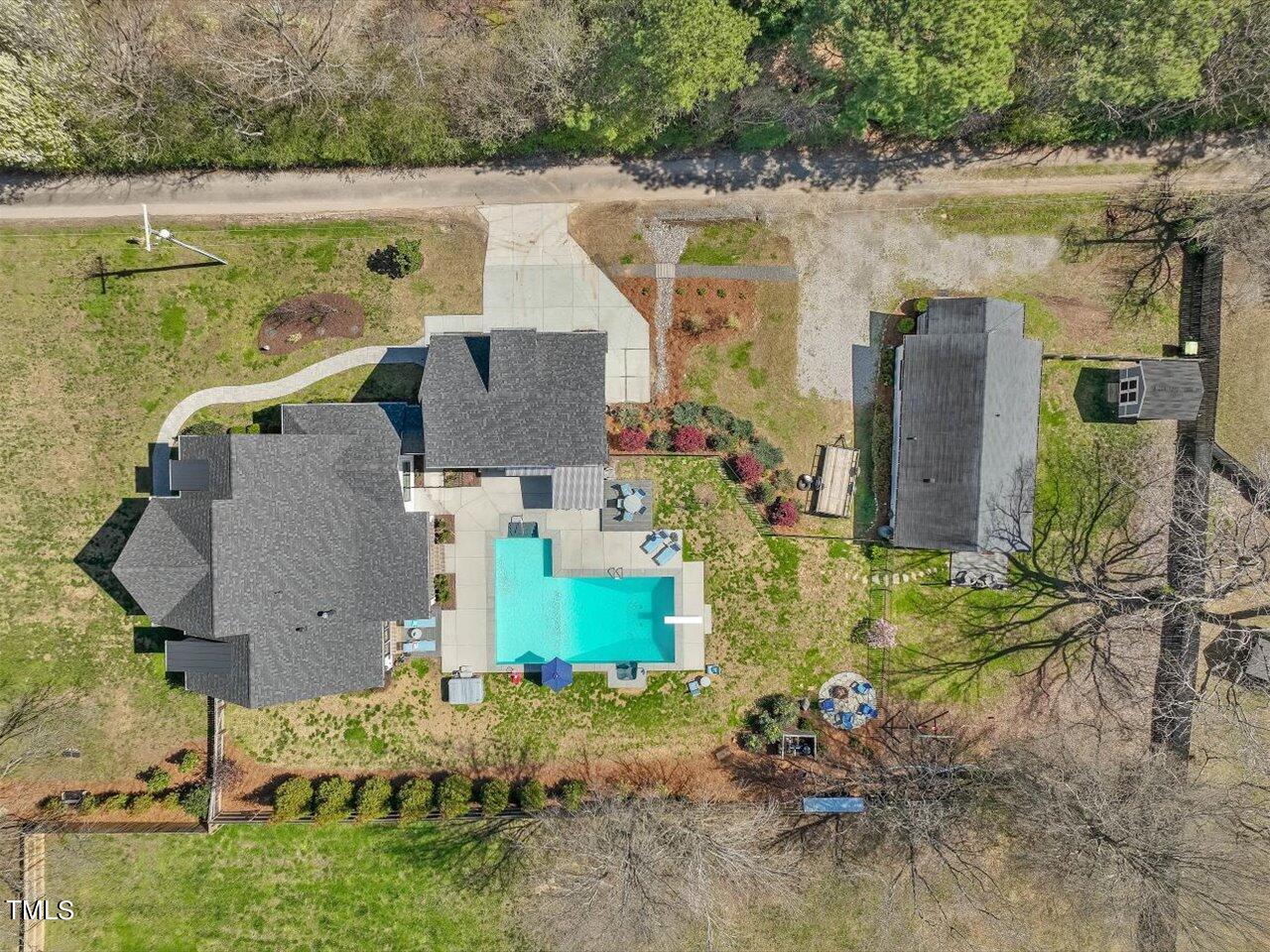 9117 Penny Road Raleigh, NC 27606 - Photo 69 of 72 an aerial view of a house with a yard and lake view