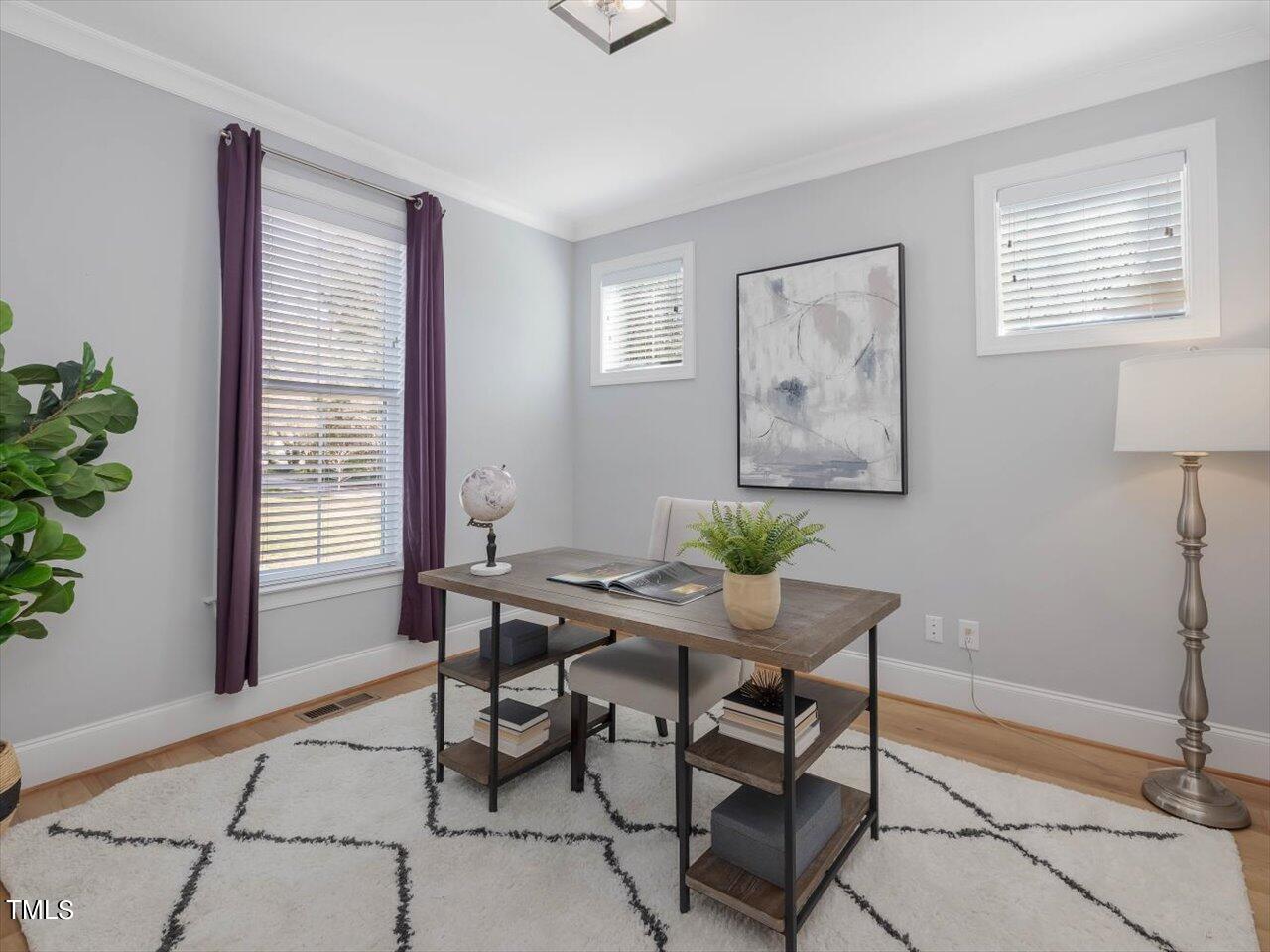 9117 Penny Road Raleigh, NC 27606 - Photo 7 of 72 a view of a workspace with furniture and a window