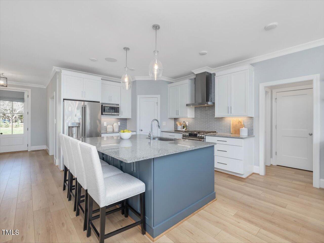 9117 Penny Road Raleigh, NC 27606 - Photo 8 of 72 a kitchen with stainless steel appliances granite countertop a sink stove and refrigerator