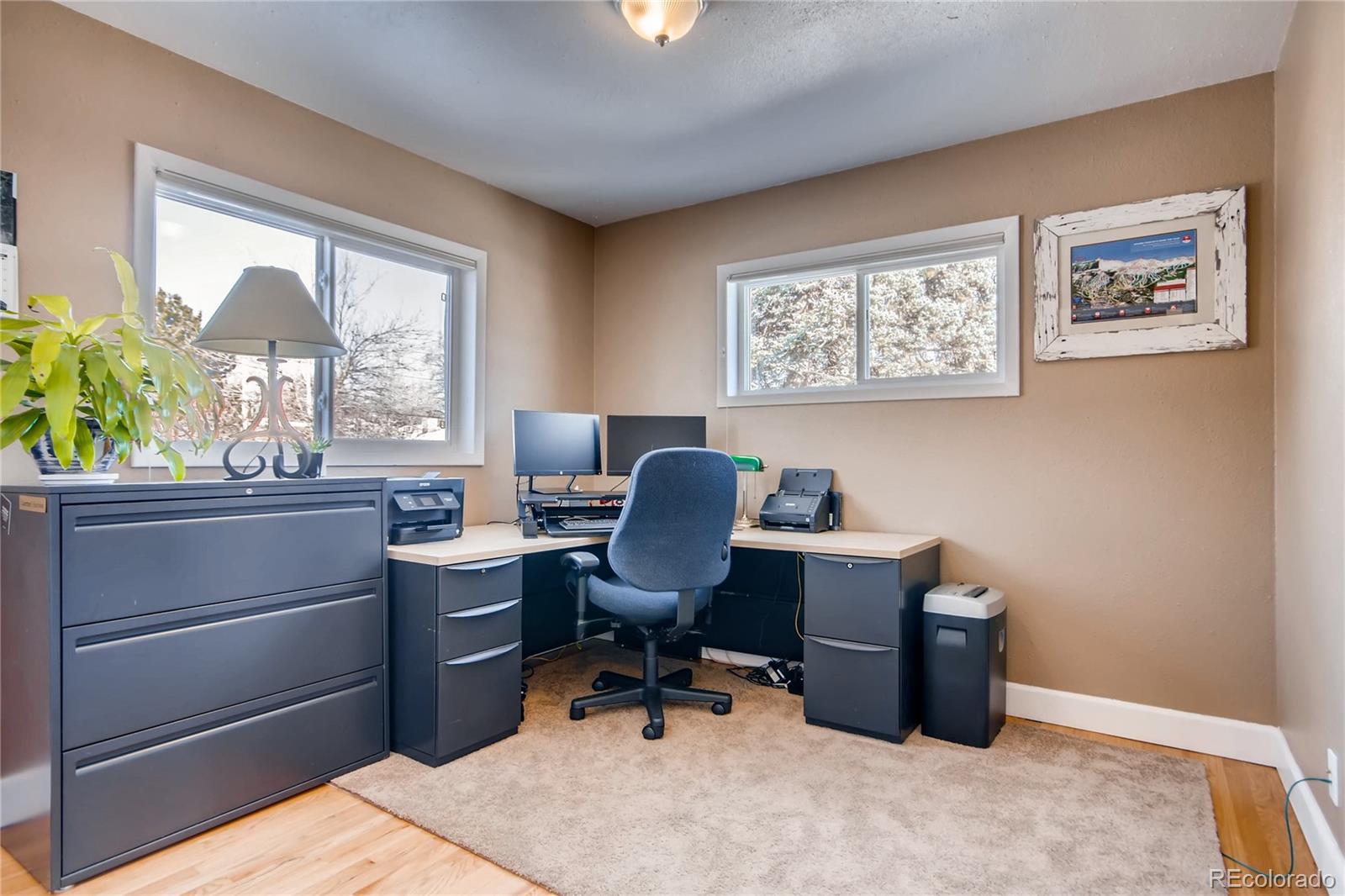 3315 West Pimlico Avenue Englewood, CO 80110 - Photo 13 of 35 a view of a workspace with furniture and a window