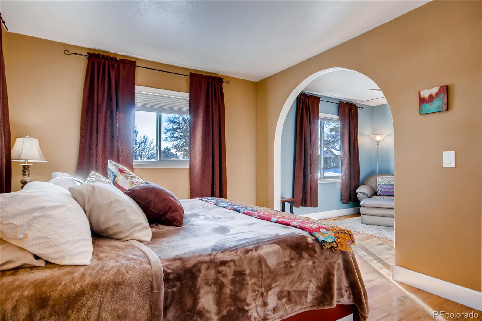 3315 West Pimlico Avenue Englewood, CO 80110 - Photo 14 of 35 a bedroom with a large bed and a large window