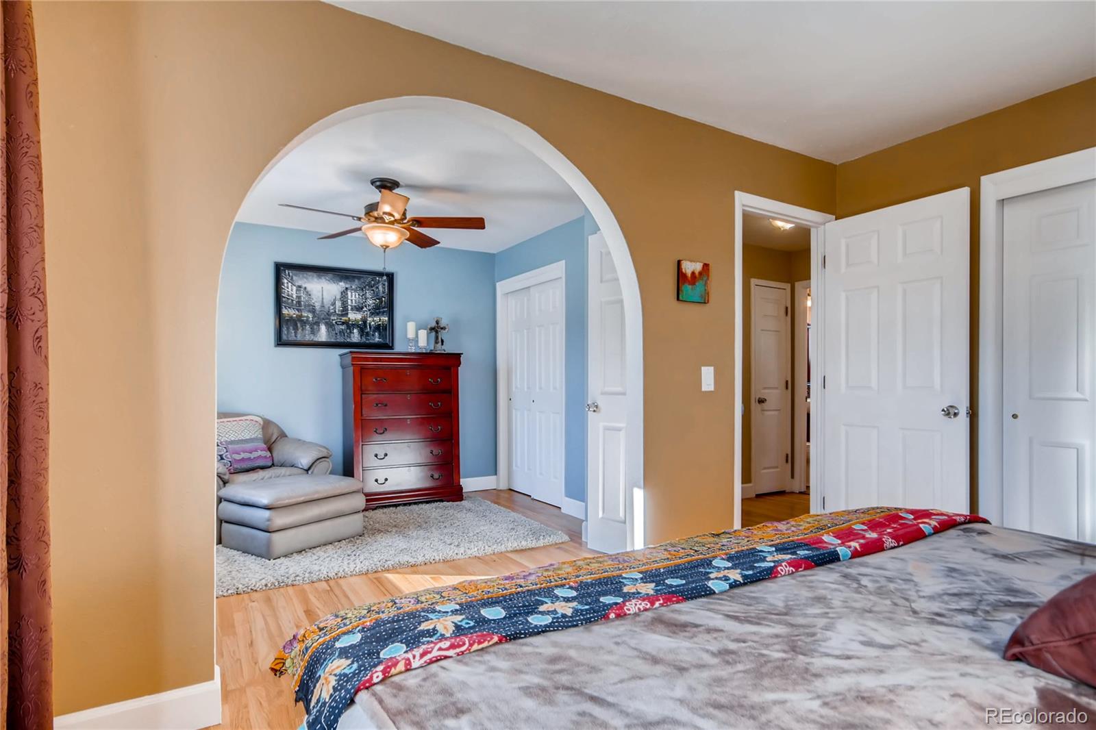 3315 West Pimlico Avenue Englewood, CO 80110 - Photo 16 of 35 a bedroom with a bed and a painting on the wall