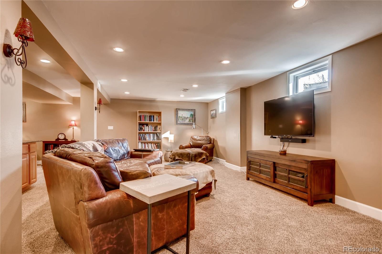 3315 West Pimlico Avenue Englewood, CO 80110 - Photo 18 of 35 a living room with furniture and a flat screen tv