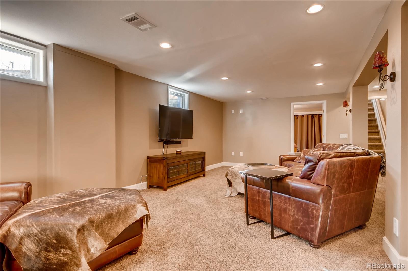 3315 West Pimlico Avenue Englewood, CO 80110 - Photo 20 of 35 a living room with furniture and a flat screen tv