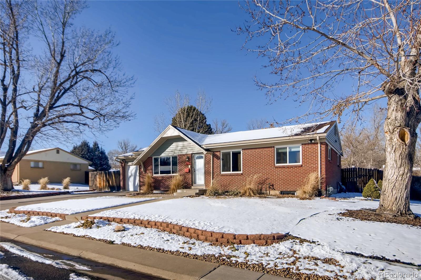 3315 West Pimlico Avenue Englewood, CO 80110 - Photo 2 of 35 a front view of a house with a yard
