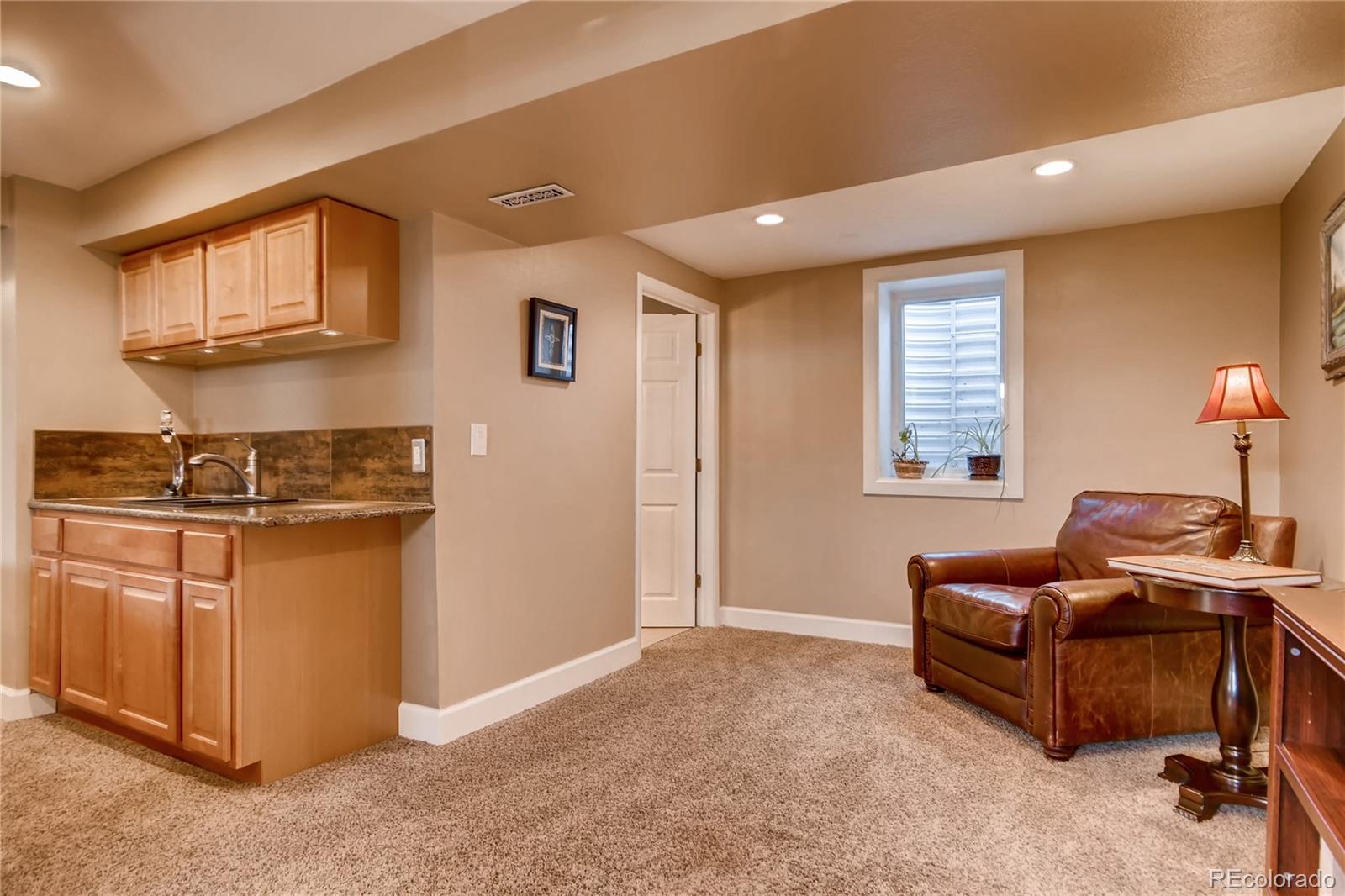 3315 West Pimlico Avenue Englewood, CO 80110 - Photo 22 of 35 a living room with furniture and a window